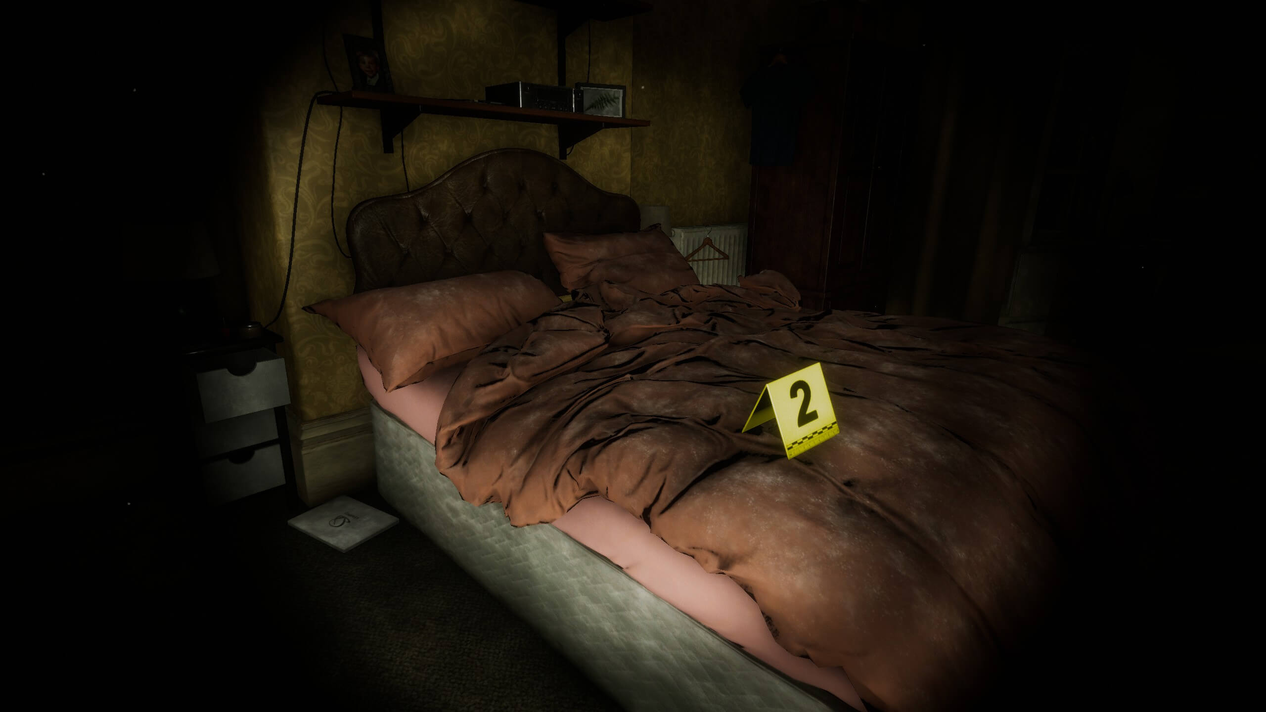 A bed in a dark room from Eternal Threads